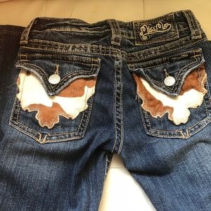 Miss Me flap pocket low rise boot cut jeans.